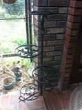 Wrought iron plant stand, live plants and garden décor.