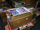 Boxes and boxes of VHS tapes, CDs and books on tape.