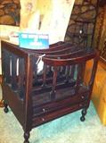 Unusual large magazine rack with flat drawers.
