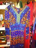 We found about a dozen vintage dresses! Other vintage items are some hats, gloves, hankies, scarves and men's polo-style shirts.