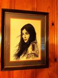 Pair of Native American framed portraits on glass.