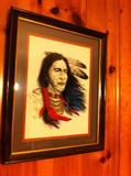 Pair of Native American framed portraits on glass.