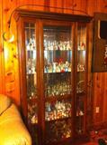 China or curio cabinet; this one just happens to be filled with bells.