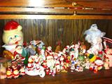 Shelf full of Christmas bells and decor, some vintage.