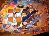 Vintage hand-pieced quilt blocks, also complete quilts, quilt rack and antique quilting frame.