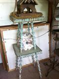 Authentic folk art spool table with weathered paint.