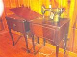 At least three antique or vintage sewing machines.