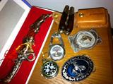 Men's watches, belt buckles and knives.