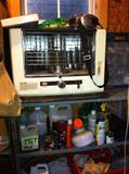 Shelves of tools, product, heater and other stuff.