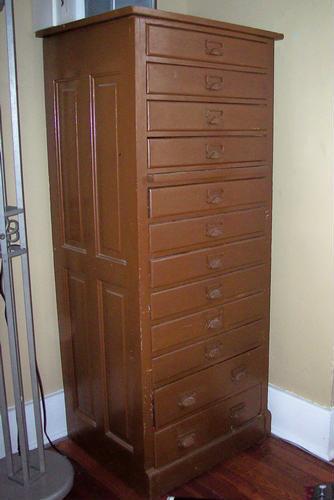 Unique antique storage cabinet. Has 12 drawers, nice metal pulls.