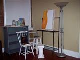 Assortment of shelves, tables, chairs, racks, art and lamps.