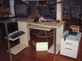 Computer desk and matching file cabinet, office items.