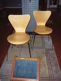 Wooden laminate contour chairs--cool! Footstool in foreground.