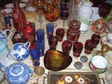 Assorted glassware with variety in size, color, technique, age and intended use.