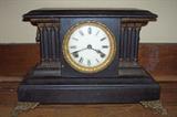 Antique mantle clock with key.