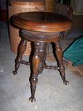 Walnut ball and claw piano stool.