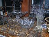 Assorted crystal vases, candleholders, accent pieces.