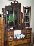 Walnut and burled walnut dressing table with swivel mirrors.