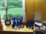 BLUE GLASSWARE AND KEROSENE LAMP