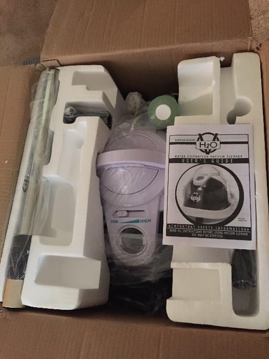 New in Box Thane H2O Water Filtration Vacuum Cleaner.  We also have new in box Thane Mop System