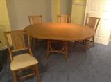 Matching rattan table, with leaf, and four chairs