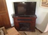 one of two flat screen TV's, Hampton Bay electric fireplace/speaker system/TV stand