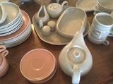 Salmon and gray dishes, tea pot, serving platters, salt and pepper, cream and sugar, gravy boat, 12 coffee/tea cups, bowls, saucers, dessert plates and dinner plates--- all Russel Wright