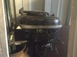 Vintage Wizard boat motor, among others