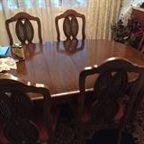 Nice table with 3 leaves and 6 cane back chairs