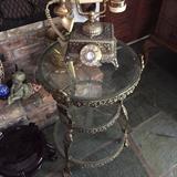 Vintage telephone and heavy brass & glass table