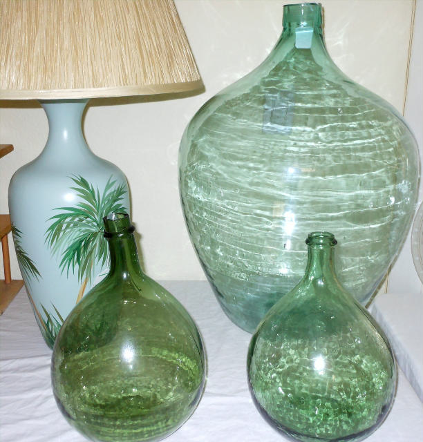 Showing one of two matching Palm Tree Lamps, 26 Inch tall huge Green Glass Glass Bottle and 2 smaller Green Glass Bottles