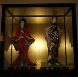 Encased Asian Dolls in Excellent Condition
