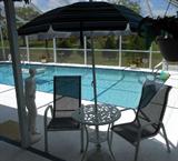 Wrought Iron Table and Umbrella