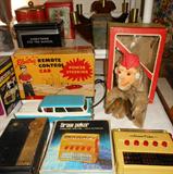 Vintage Electric Remote Control Car with Original Box, Wind Up West German Vintage Monkey with Symbols, Zenith Royal 250 Transistor Radio and Vintage Draw Poker Game
