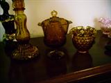 SEVERAL PIECES OF AMBER GLASS
