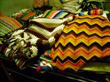 MANY HANDMADE AFGHANS AND QUILTS