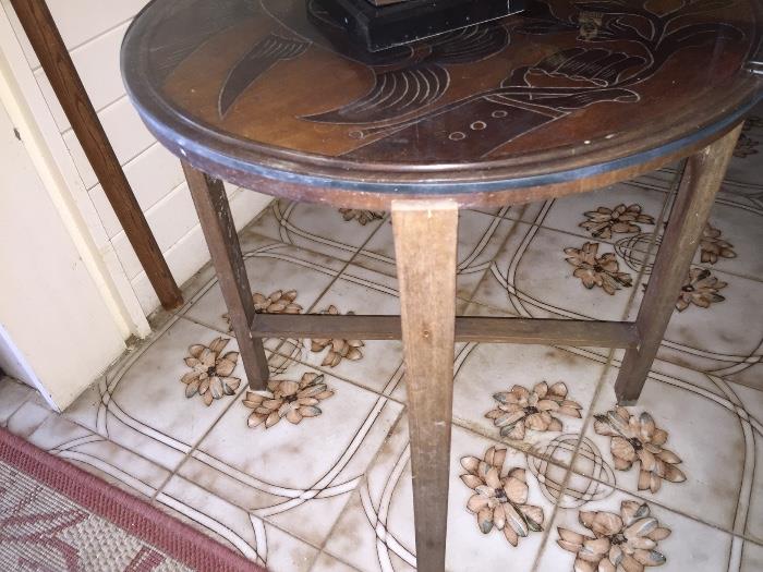 Round carved top side table