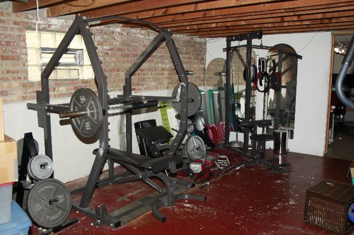 professional gym equipment Self spotting Smith rack, lat pull down and universal Olympic weights over 450 pounds in weight.