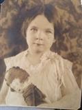 Vintage photo of child and doll.