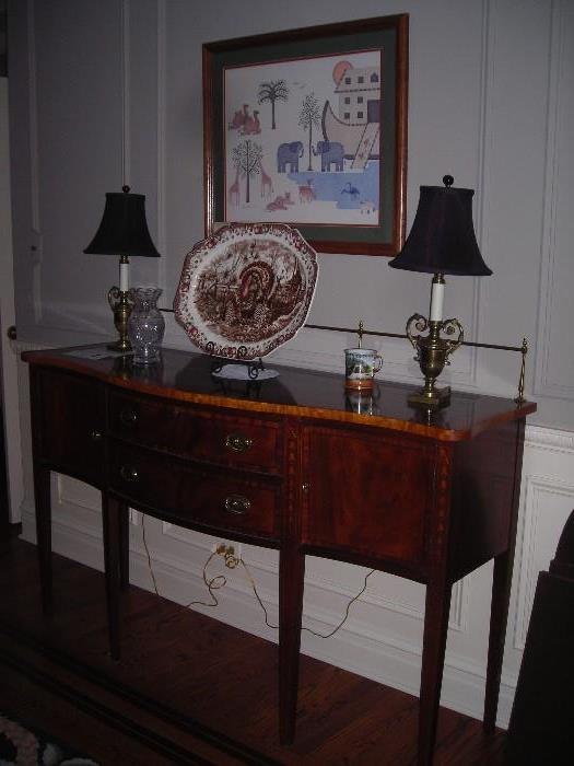 The server with large turkey platter and a pair of antique lamps