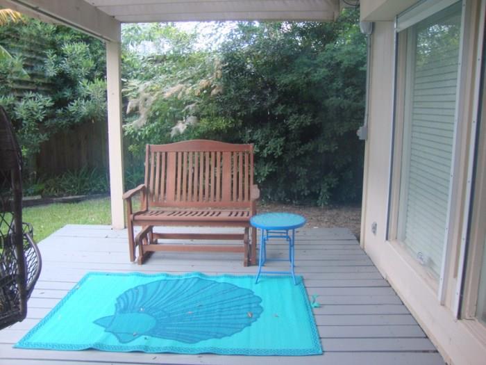 Wood Glider and outdoor rug