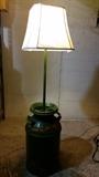 Grandmother's craftsmanship on turning old milk can into lamp with farm animal decopoged on top and bottom of tank.  Very Sweet!
