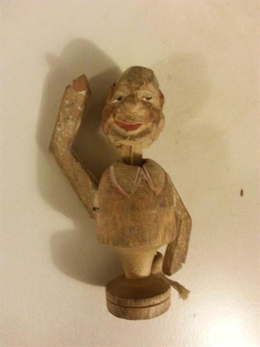 Vintage wood figure with pull string to make arm wave