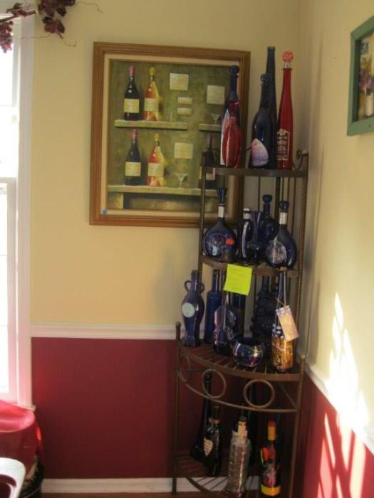 Large collection of pretty colorful bottles- This wine rack is not included in sale.
