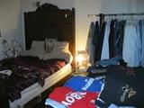 Antique bed and men's clothes