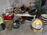 Hats, baskets, garden bench, artificial palm