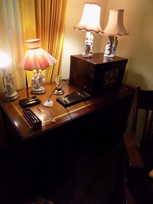 leather top writing desk...several pair porcelain figural lamps