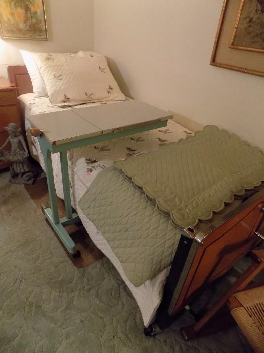 Hospital bed with bedside table