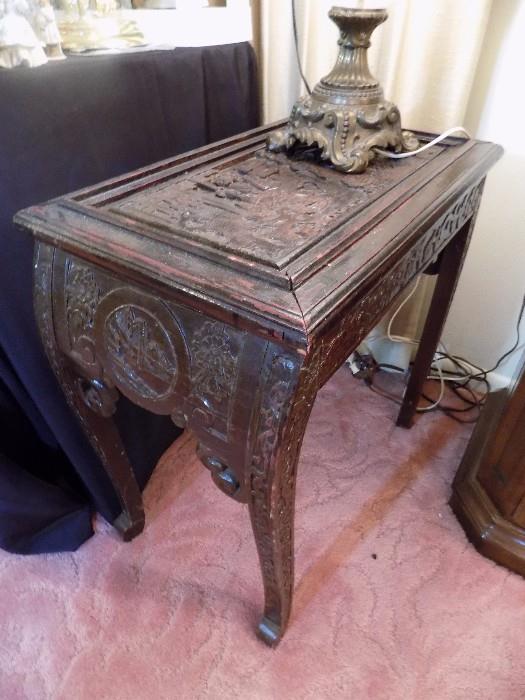 heavily carved accent table