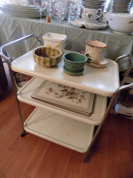 vintage metal rolling cart and pottery